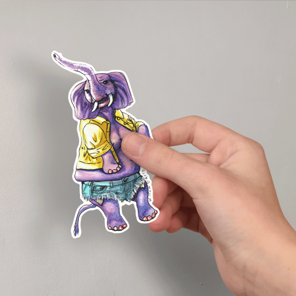 Photo of a hand holding a sticker of an illustration of a sassy elephant in a cute jacket and shorts.