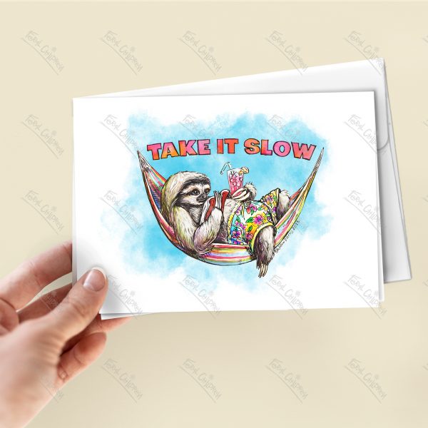 Sloth in Hammock with Book and Pink Iced Lemonade wearing Brightly colored hawaiian print shorts - illustration on a greeting card with the words "take it slow" - card in a hand.